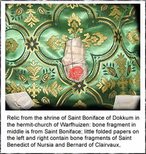 Relic from the shrine of Saint Boniface of Dokkum in the hermit-church of Warfhuizen: bone fragment in middle is from Saint Boniface; little folded papers on the left and right contain bone fragments of Saint Benedict of Nursia and Bernard of Clairvaux