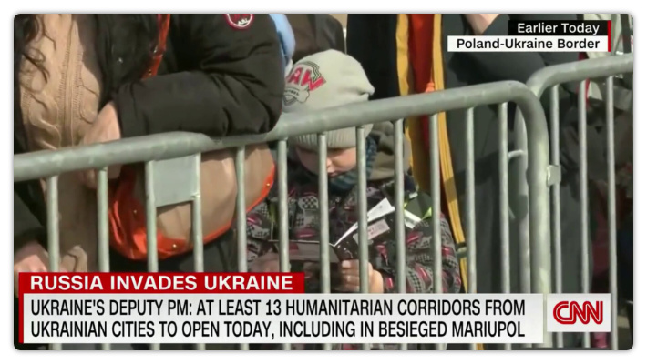 Young Ukrainian refugee reading a tract on a live CNN broadcast